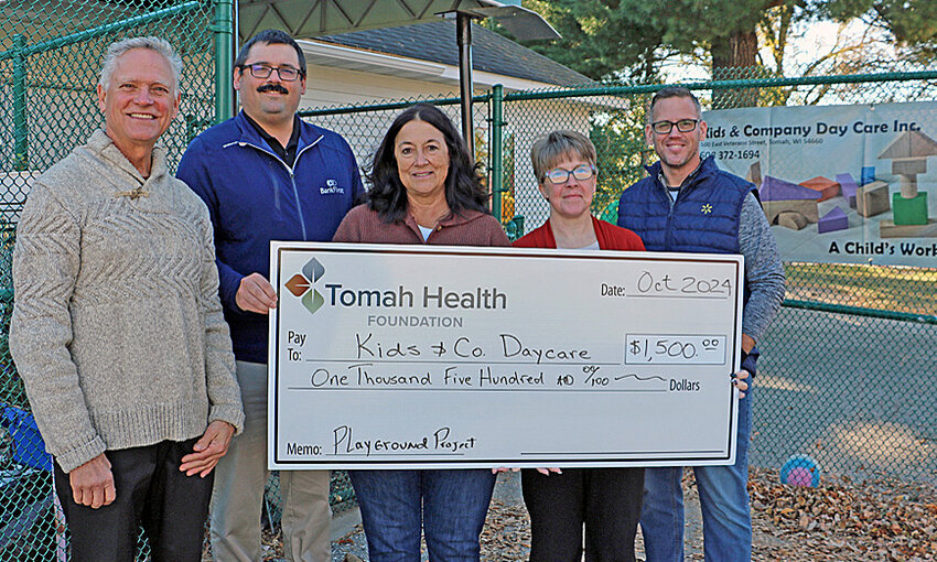 Tomah Health Community Foundation President, Brian Eirschele (left), along with foundation directors, Kyle Von Haden and Jenny McCoy, presented a ceremonial check to Kids and Company Day Care administrator, Heather Wilcox, and Kids and Company Day Care executive board chairman, Travis Scholze, on October 17th.