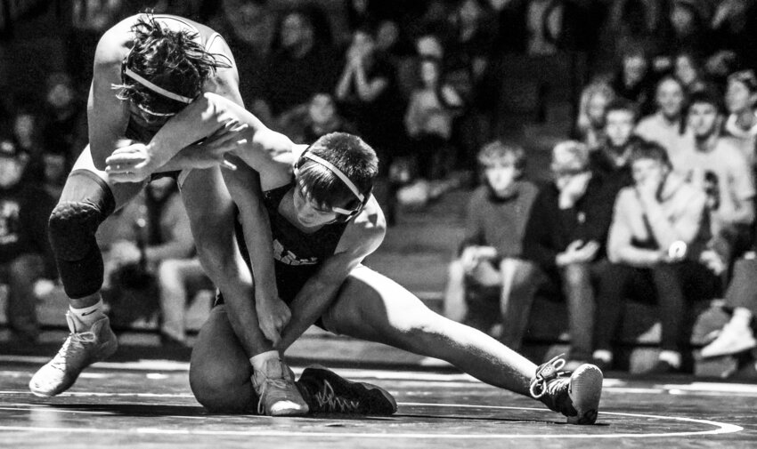 Tomah&rsquo;s CJ Iverson works an ankle pick against Sparta&rsquo;s Monte Ramirez during the 138 pound match Thursday night. Iverson won with a pin at the end of the first period to put Tomah on the board with the team&rsquo;s first win of the match.