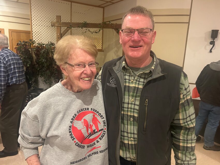 SACS co-president Karen Edward poses with Sean Pfaff, of Fast Eddie&rsquo;s who supplied 110 high-end bottles of bourbons for the annual auction in support of SACS.