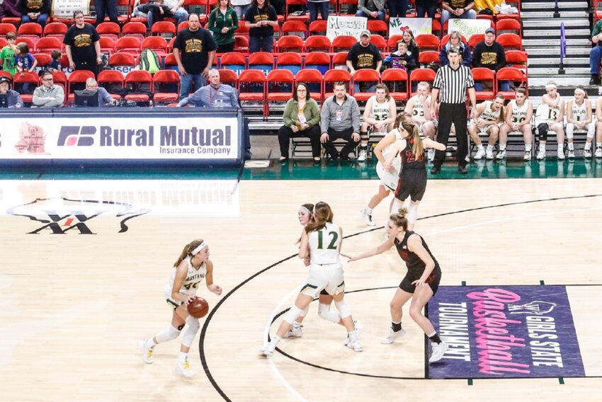RIGHT Several dozen Melrose-Mindoro fans watch as their girls basketball team plays Mishicot in the Division 4 state semifinals.
The game would go to overtime and the M-M girls would advance to the state title game for the third-straight season. However, this game was the last of the state tournament series as the WIAA cancelled the remainder of the event due to rising concerns around the coronavirus.