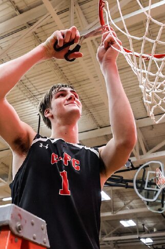 C-FC’s Cam Lipinski cuts away part of the net after winning Saturday’s sectional final game against Royall. The Pirates enter the state tournament as the top seed in Division 5.