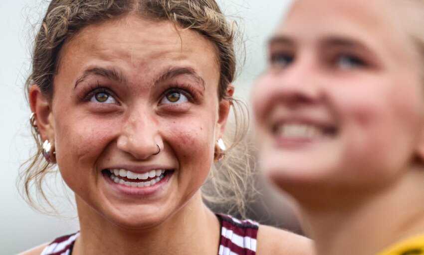 Cashton’s Makayla Gooselaw and Cadott’s Iszy Sonnentag eagerly watch the results from the 100 meter hurdle final as they’re displayed on the videoboard at the WIAA state track and field championships June 7 in La Crosse.