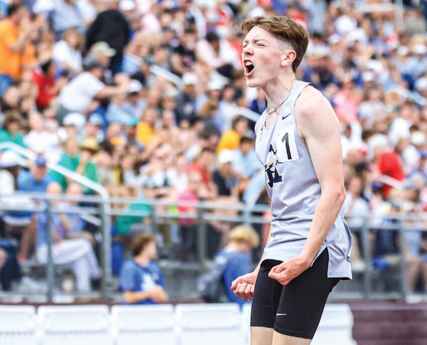 Aquinas’ Declan Gregg gives a display of excitement after winning the state
championship in the Division 2 3200 meter run. The title is the second for Gregg
after winning the Division 3 cross country championship in the fall of 2024.