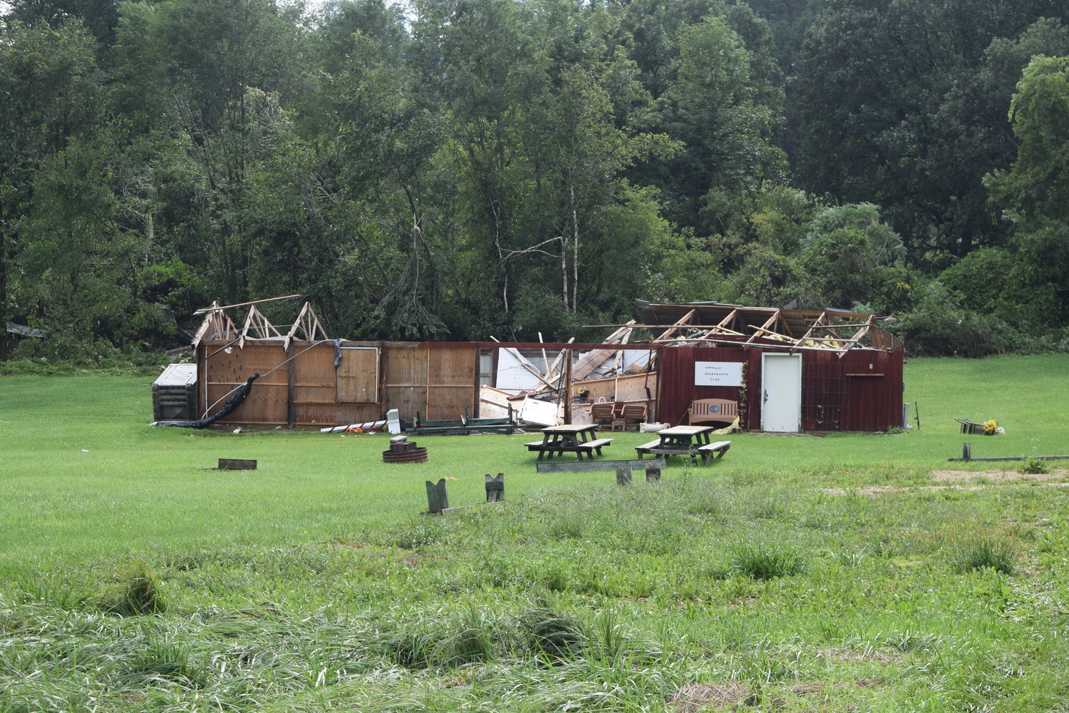 The funnel cloud, which left an 80-foot path and had wind speeds of 105 mph, damaged the nearby Norwalk Rod & Gun Club building.