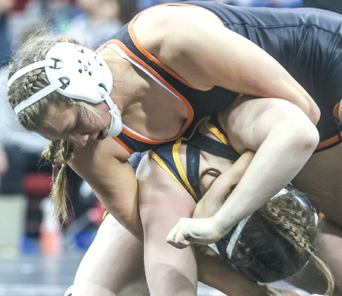 Black River Falls’ Riley Hanrahan tips New
Berlin West’s Natalia Poplawski for a pin in a
138 pound state quarterfinal match. Hanrahan
capped a perfect 28-0 season with a state
title in the weight class.