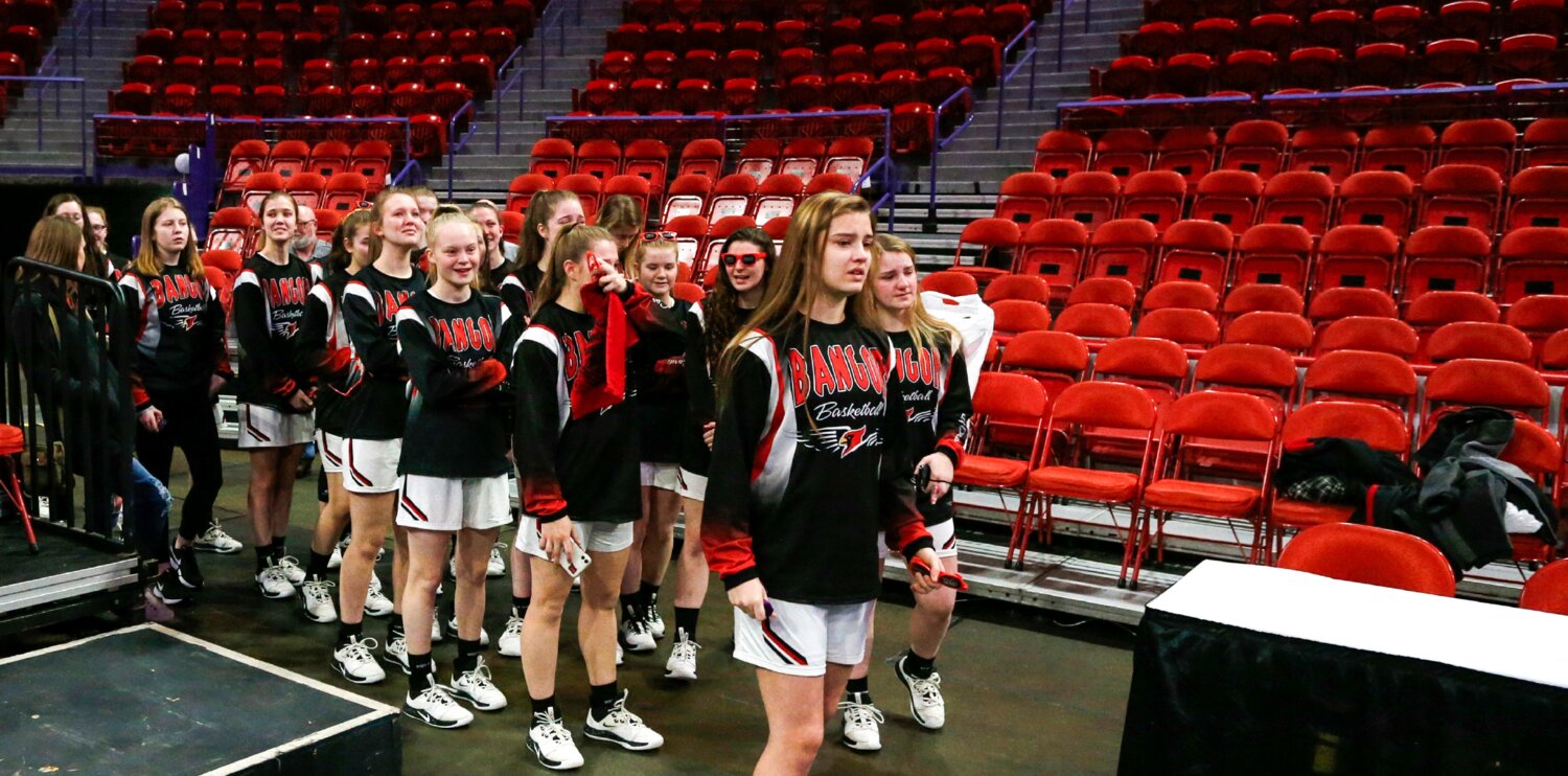 Bangor’s girls basketball team prepares to take the court inside an empty Resch Center in Green Bay following the cancelation of the 2020 state tournament.