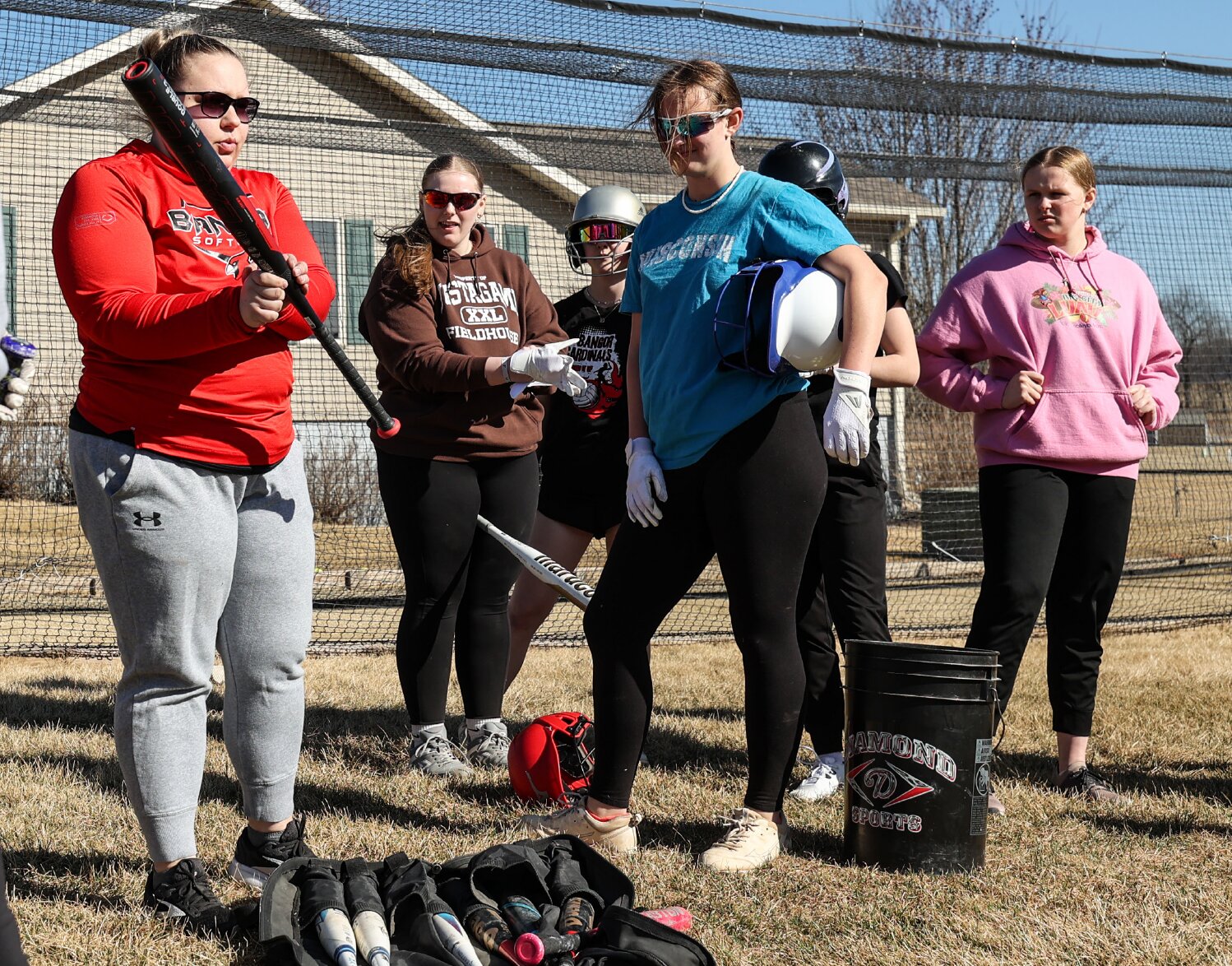 Trisha Jones explains bunting to the Bangor softball team. Jones enters her first year as the Cardinals’ head coach following a 12-year run by Dave Burritt who stepped away after last season.