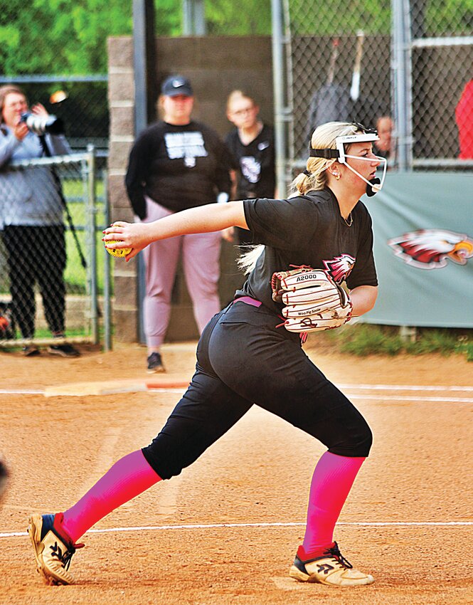 Huntsville Eagle Kennedy Smith fires a pitch from the mound in a recent game against Siloam Springs.