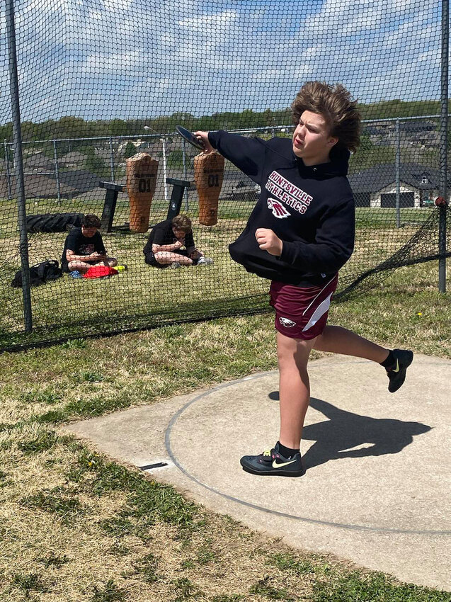 Houston Woodruff slings the discus at the District Track Meet in Gravette.