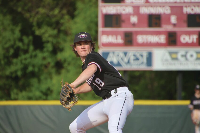 Huntsville Eagle Kolby Phillips fires one in from the mound during the District Tournament game against Farmington on April 24.