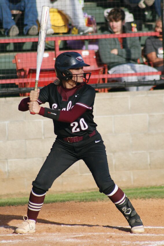 Huntsville Lady Eagle Macie Ramsey squares up at the place during the Eagles’ game against Farmington on April 22.