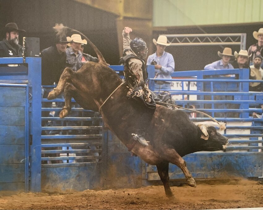 Jake Roddy of Huntsville competes in a bull riding event in Searcy.