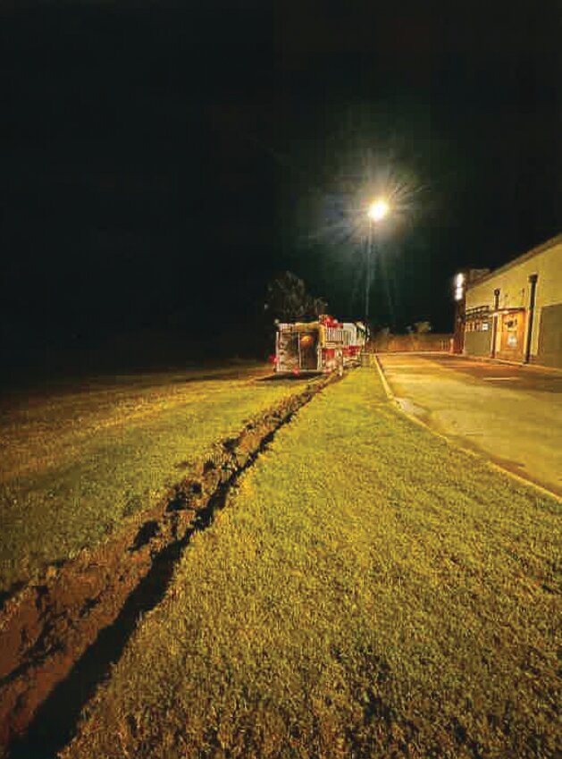 A Huntsville volunteer live-in firefighter was terminated from his position after trying to drive this fire truck carrying a full load of water across a field next to Taco Bell in the early morning hours of Oct. 6.