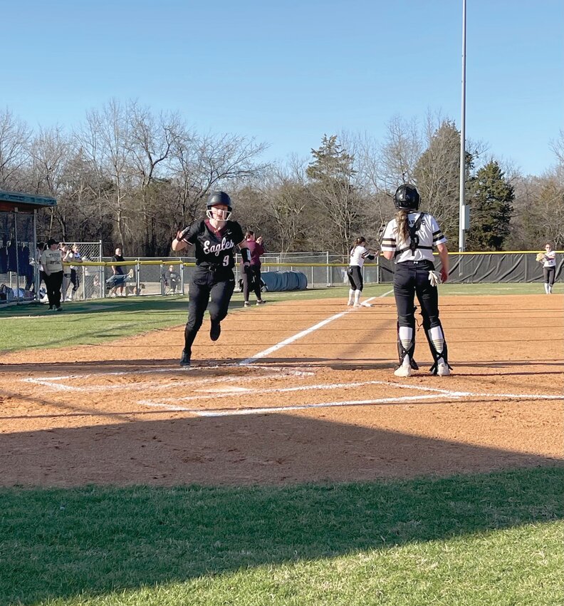Huntsville junior Ashlyn Davis runs towards home plate in a nonconference, 16-1, loss to Class 5A Alma on Monday.