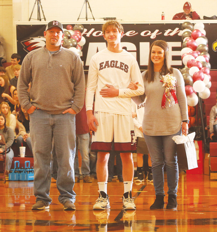 Huntsville High School held its annual Colors Night last week to honor senior athletes, cheerleaders and managers. The Eagles and Lady Eagles hosted the Berryville teams for the event last Friday.  Senior Eagles honored were Kyle Garrison, Kent Mayes, Devan McDaniel, Kolton Shepherd and Bryan Walden. Boys basketball managers honored were Alyssa Ogden and Brittany Shrum. Senior Lady Eagles honored were Madison Phillips, Kendra Poor and Josie Sisk.  Senior cheerleaders were Raina Nalley and Makayla Parsons. Parents escorted the students honored onto the floor at Charles H. Berry Gymnasium.
