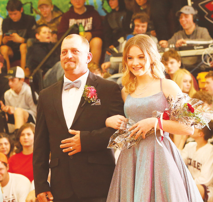 Freshman maid Madison Idell escorted by her father, Johnny Idell.