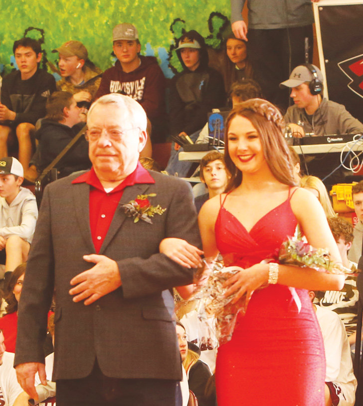 Freshman maid Allison Foster escorted by great- grandfather, Dwain Bolinger.