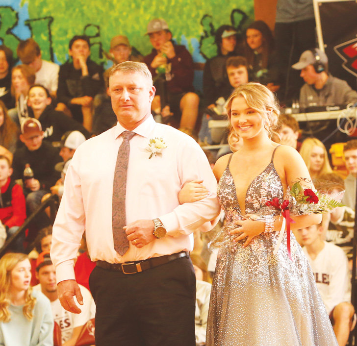 Sophomore Kinley Ryanne Bennett escorted by her uncle, Kevin Eiland.