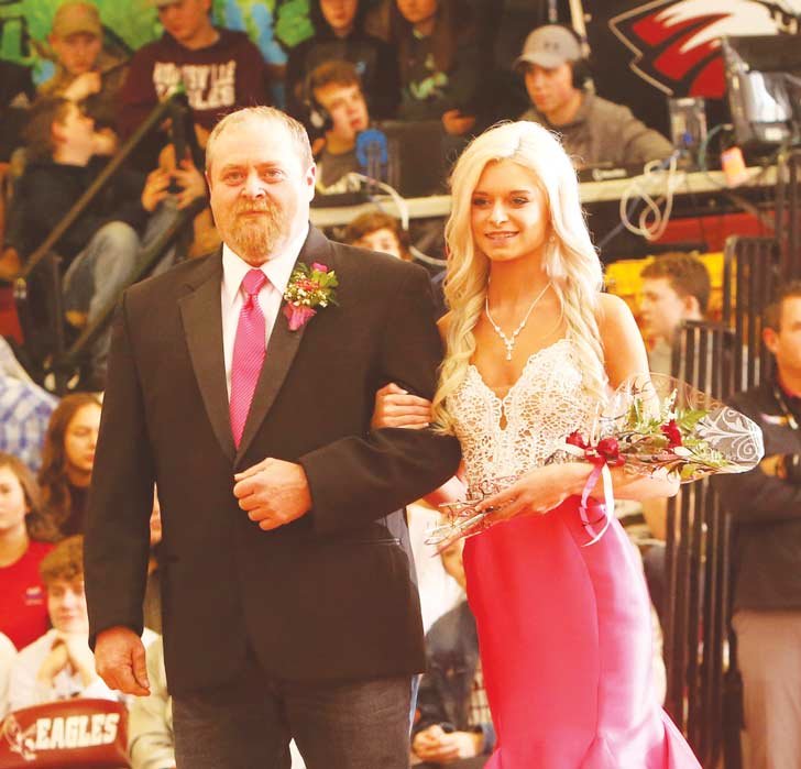 Senior Brittany Shrum escorted by her father, Shannon Shrum.