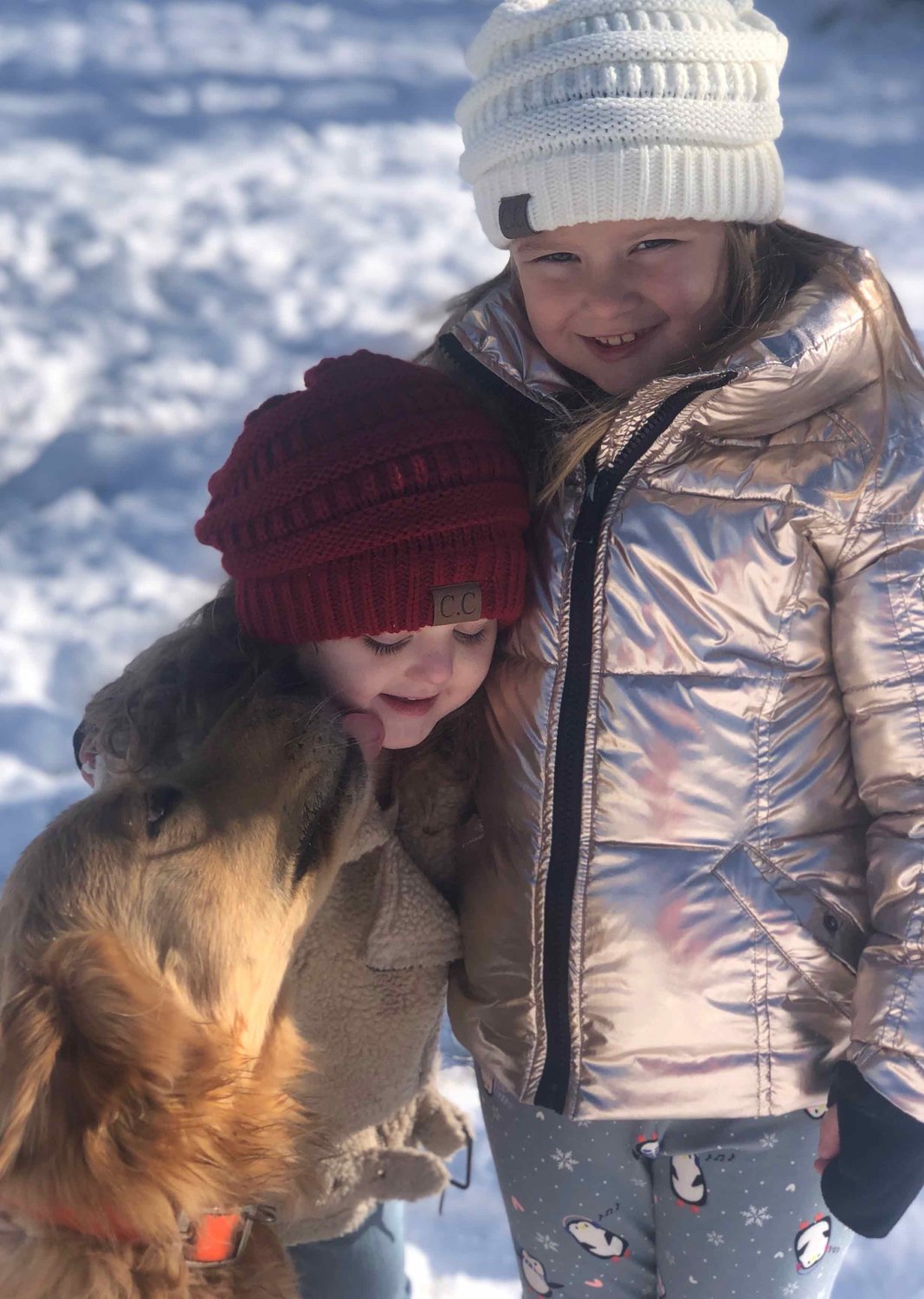 Sisters Gracie and Brinkley Sparks spent the day playing outside with their dog Oliver.