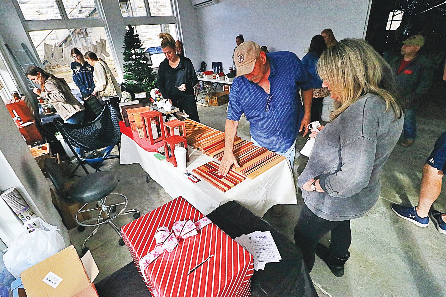 Shoppers browse the many offerings available at Holiday Market.