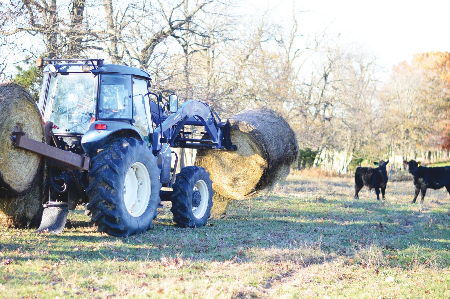 Kenny delivers a bale of hay.