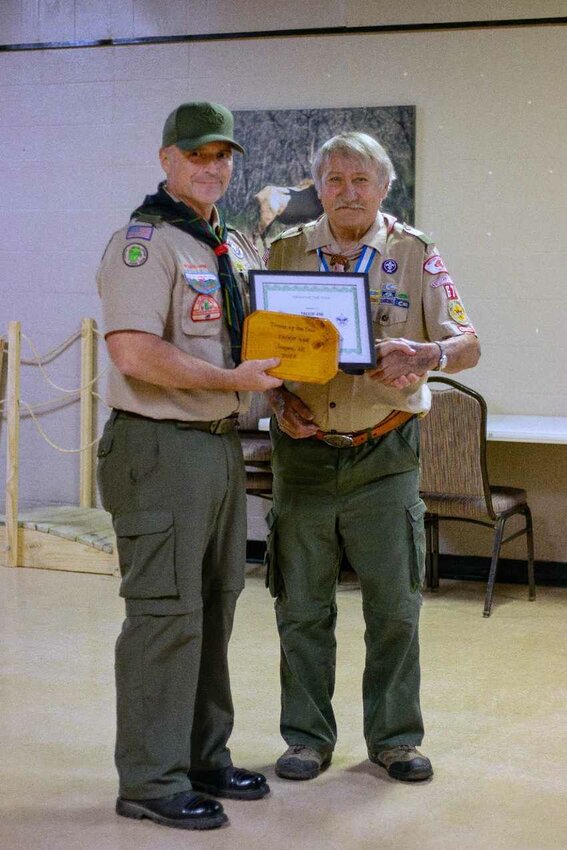 Boy Scouts of America Ozark District held its annual awards program on April 11. Pictured left is Mike Thomas, scoutmaster of Troop 446 of Jasper receiving the Scout Troop of the Year Award from District Volunteer Bruce Bieschke.