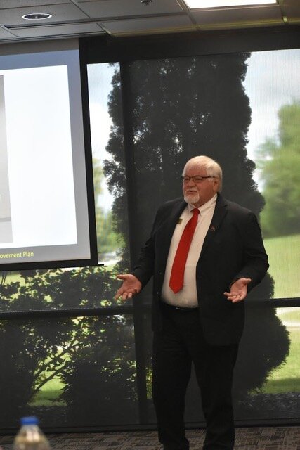 North Arkansas College president Dr. Rick Massengale addresses the board of trustees of the college. Massengale has been charged with leading the college forward to joining the University of Arkansas System.