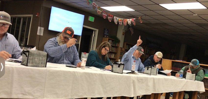 The Jasper School District Board of Education takes a vote during the January board meeting as superintendent Dr. Candra Brasel documents the results.