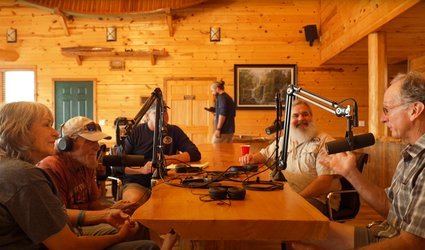 From left to right at table: Debbie Moore, Kerry Moore, Trey Reid, Jeff Williams and Brad Wimberly talk outfitting in the Ozarks.