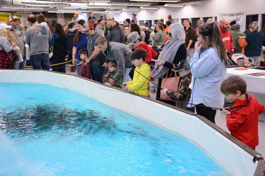 The fishing tank filled with rainbow trout from the AGFC&rsquo;s Jim Hinkle Spring River State Fish Hatchery is always a hit at the AGFF Kids Zone.
