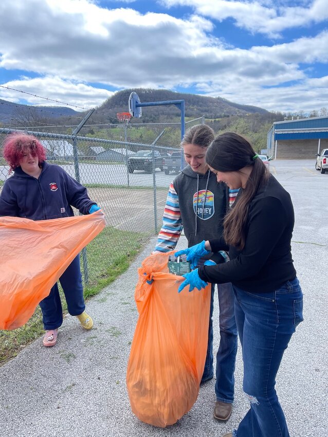 Mt. Judea School students are policing the school grounds picking up trash as part of the annual Newton County Clean-up. Pictured from left are, Sway Flippo, Malcie Williams  and Myleigh Ricketts.