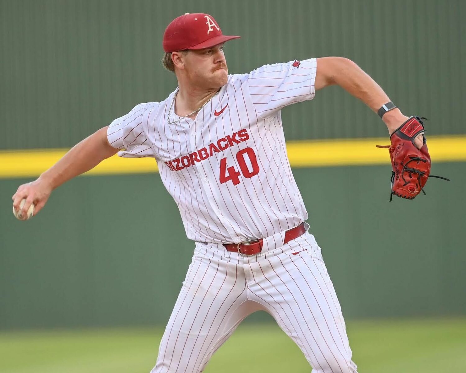 CRAVEN WHITLOW/NATE ALLEN SPORTS SERVICES   Razorback sophomore pitcher Ben Bybee from Overland Park, Kan. attempts a pickoff at first base against Mississippi State at Baum-Walker Stadium&nbsp;in Fayetteville. Arkansas was eliminated in two games in the SEC Tournament.