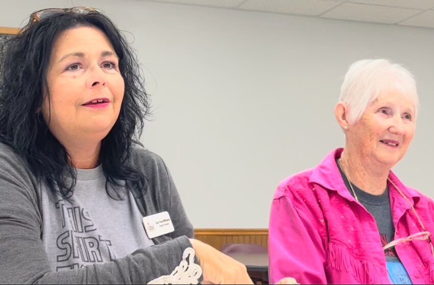 Kim Paul-Williams, a program manager for the Arkansas Single Parent Scholarship Fund (ASPSF), left, and Nelda Casey, a Newton County ASPSF volunteer at the Community Matters meeting in Jasper last May 23.