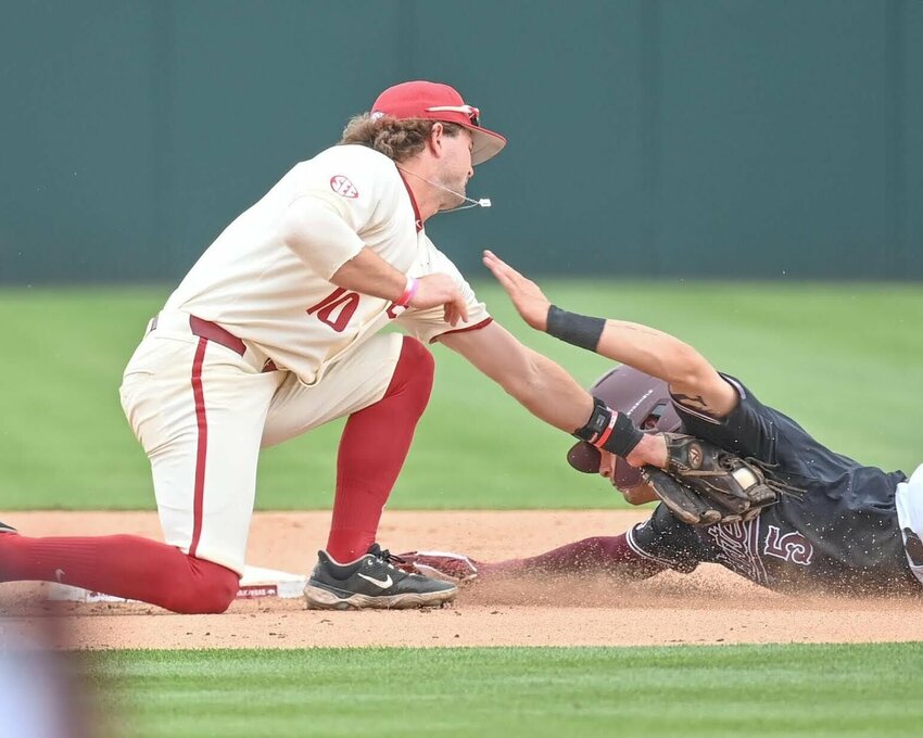 CRAVEN WHITLOW/NATE ALLEN SPORTS SERVICES   Razorback junior second baseman Peyton Stovall from Haughton, La. makes a tag for a putout on an attempted steal by Mississippi State at Baum-Walker Stadium&nbsp;in Fayetteville. Stovall and the rest of the Arkansas team will now prepare for the upcoming NCAA Tournament.