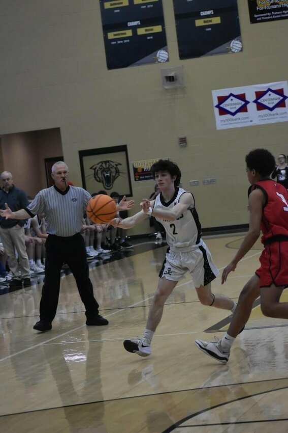 JEFF BRASEL/STAFF   Jasper junior Ty Williams looks for a teammate with a pass for the Pirates in the Class 1A State Basketball Tournament. The Pirates fell to Blevins in the first round game on Wednesday.