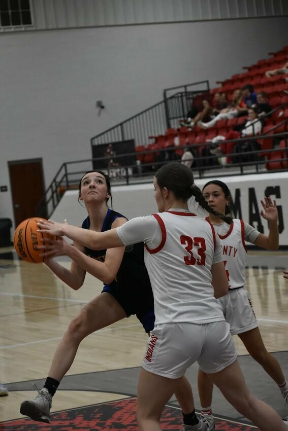 JEFF BRASEL/STAFF   Kylee Weaver of Kingston makes a move in the paint on Thursday night against County Line in the Class 1A Region 1 Tournament in Magazine. County Line came back defeated the Lady Yellow Jackets, 44-40.