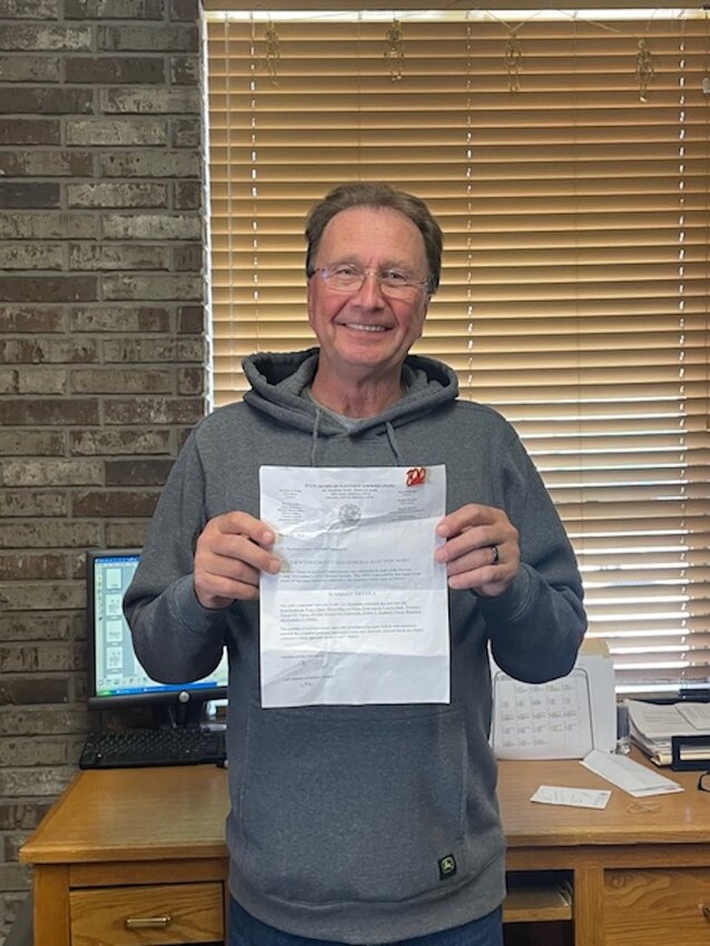 Newton County Clerk Donnie Davis holds a letter received from the State Board of Election Commissioners that recently conducted an audit of the 2024 General Election held in Newton County. The county received a 100% accuracy score. Charlie Morris, of the SBEC, presented the letter of recognition to Davis for the county's level of voting integrity.
