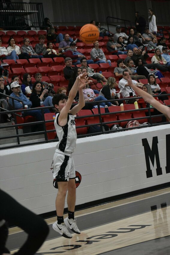 JEFF BRASEL/STAFF   Jasper junior Blake Williams fires a shot from the outside for the Pirates during play in the Class1A Region 1 Tournament. The Pirates finished second in the tournament and will play Wednesday at 5:30 p.m. in the Class 1A State Basketball Tournament.