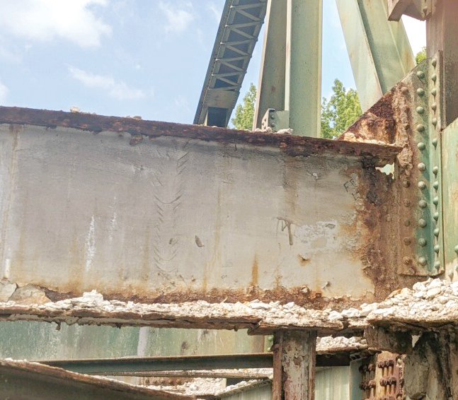 Decking has been removed from the old Pruitt bridge in anticipation of demolition next week. The photo shows corrosion of the steel structure in the 90-year-old bridge.