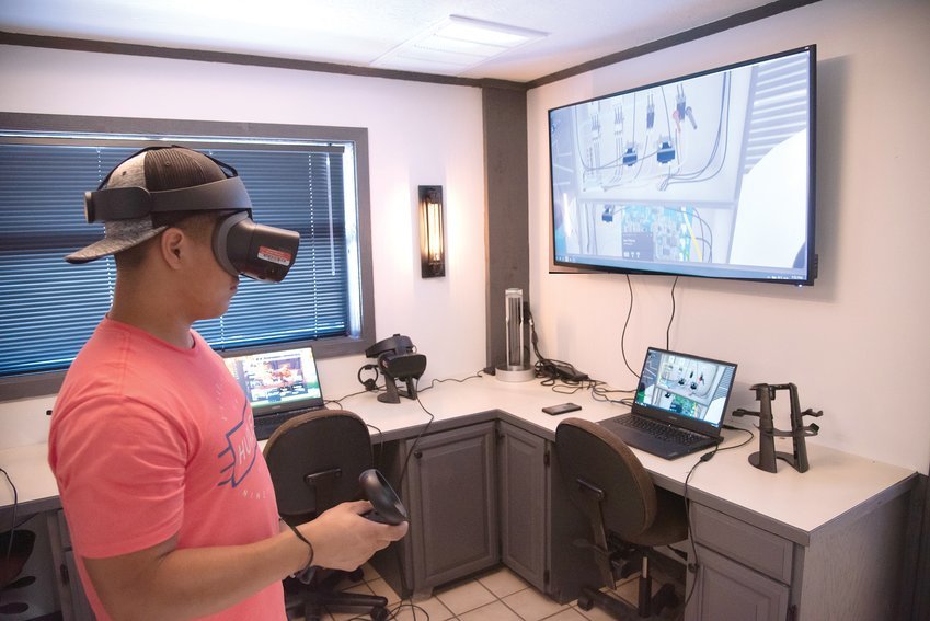 Carlos Escobar, a North Arkansas College heating, ventilation and air conditioning student, uses virtual reality for training.