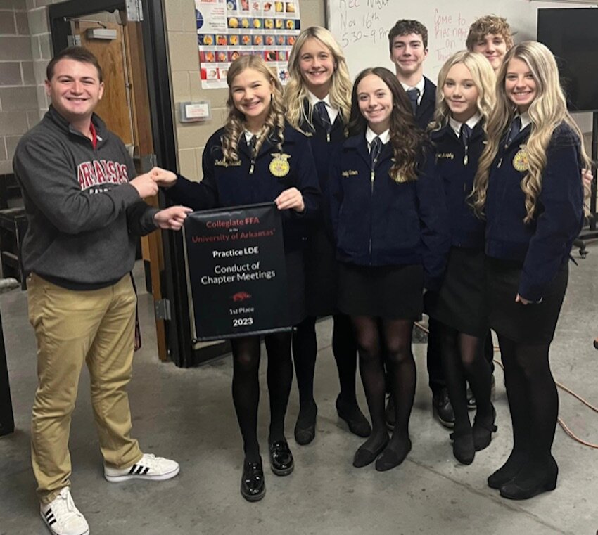 Members of the Jasper FFA exhibit the first place award for Conduct of Chapter Meetings earned at the University of Arkansas Leadership Competition.