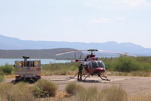 Fueling a Type 3 helicopter for a reconnaissance mission over the Black Fire area, at a base near Roosevelt Lake.
