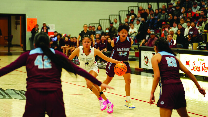 Steven Law Lady Tayla Franklin slashes through Ganado defenders on her way to 17 points Friday night.
