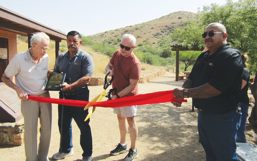 A ribbon cutting ceremony Thursday morning celebrated the renaming of Round Mountain Park to Stanley M. Gibson Round Mountain Park, in honor of the former Globe mayor and longtime city councilman who was key in creating the popular system of hiking trails. Pictured, from left, are Stanley Gibson, Globe Mayor Al Gameros, Gibson’s son Mark Gibson and Globe Public Works Director John Angulo.