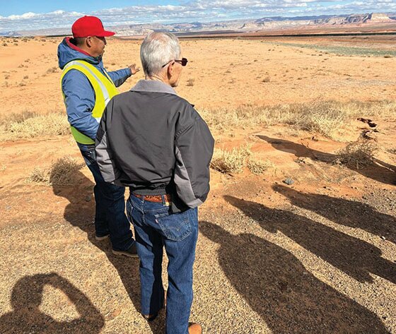 Salt River Project Civil Engineer Mario Gorman describes the erosion berm beyond the former site of NGS evaporation ponds to Page Mayor Bill Diak.