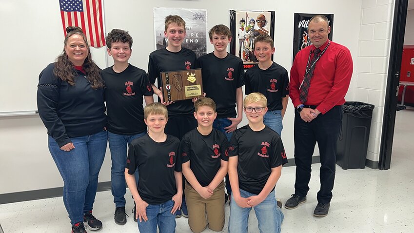 The scholastic bowl team featured, front row, left to right, Blake Mumm, Charlie Schoenholz, and Abel Mumm, back row, left to right, coach Yvonne Hicks, Parker Zimmerly, Jason Hemmen, Tyler Mahar, Owen Dallam, and AJHS Principal Andrew Full.