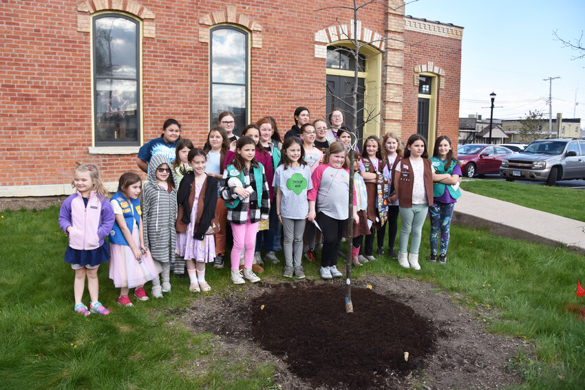 Girl Scouts from the Southern Ogle County Service Unit helped plant a tree at the Flagg Township Museum on April 23. Scouts from Troops 409, 1870, 2122, and 1168 took part in the tree planting ceremony.