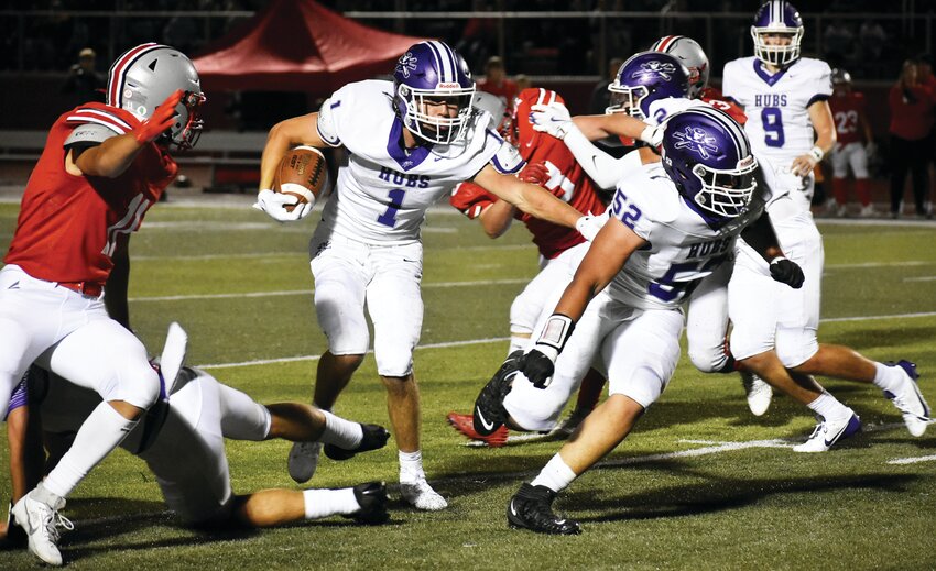 Senior Grant Gensler follows a block from lineman Markell Pogue during the Rochelle Hub varsity football game against Morton on Friday.