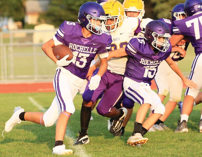 Freshman Tyson Pavlak runs toward the outside during the Rochelle Hub fresh-soph football game against Belvidere on Monday.